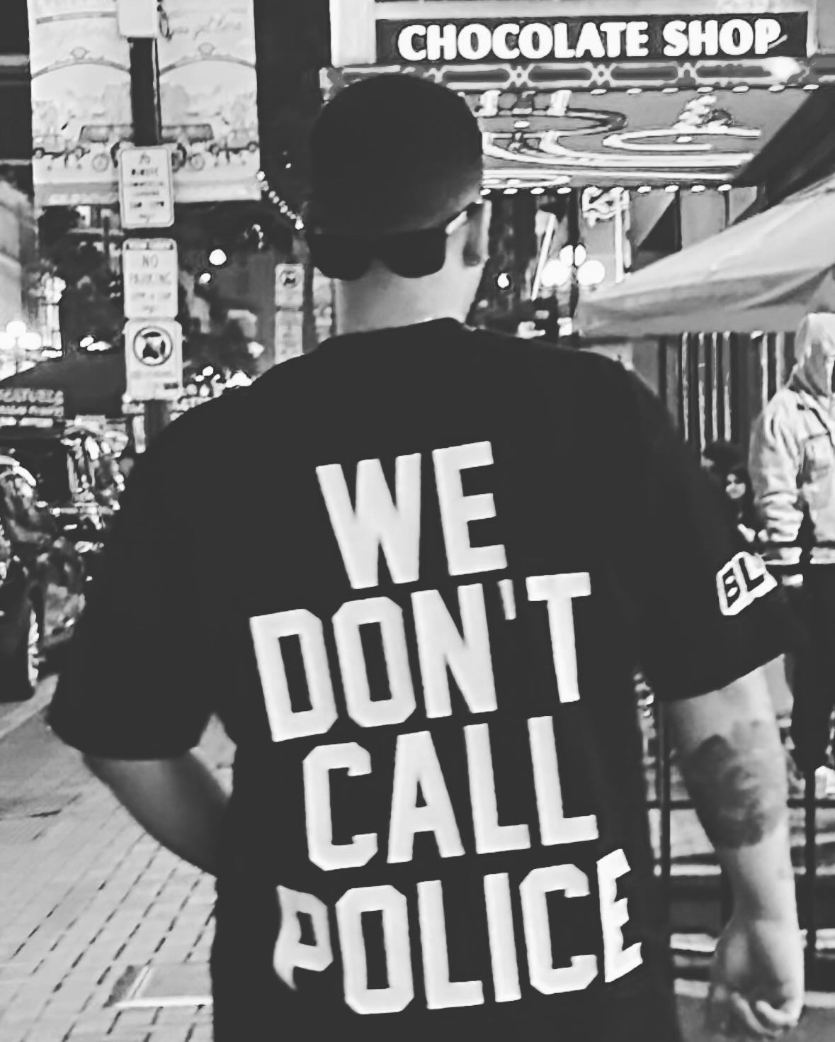 WE DON'T CALL POLICE BLACK TEE